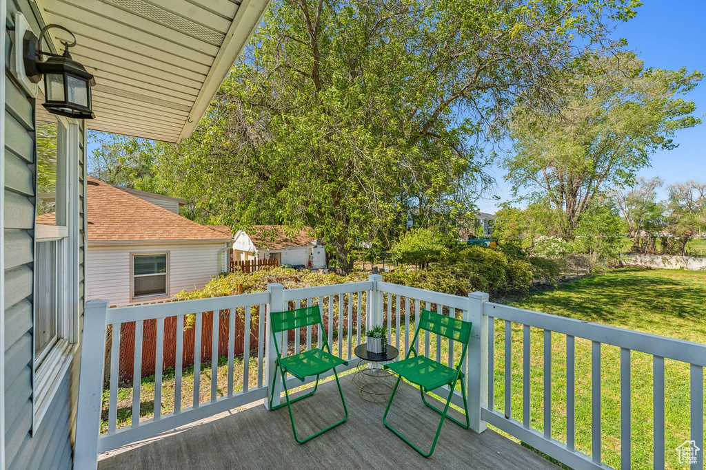 Wooden terrace with a lawn