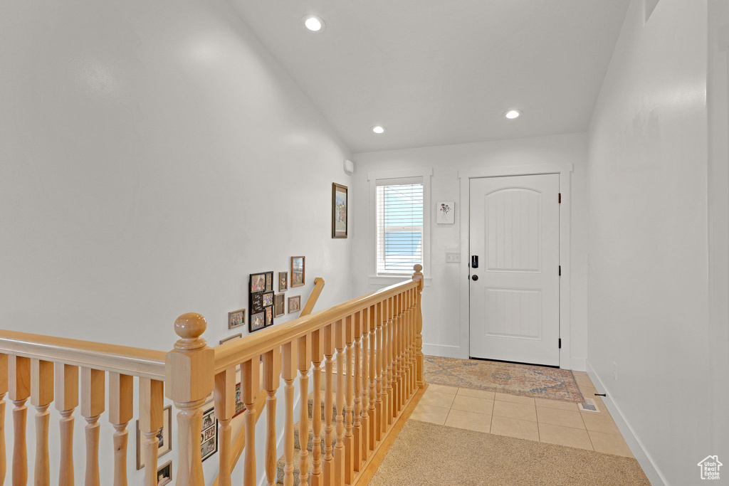 Entrance foyer featuring recessed lighting, tile patterned flooring, and baseboards