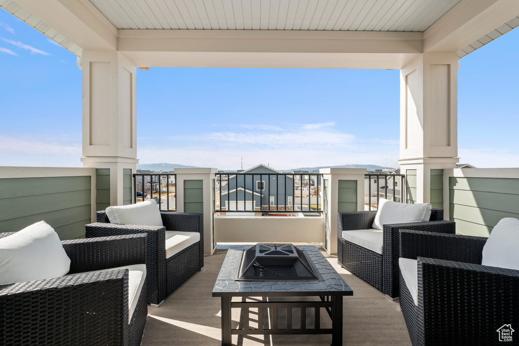 Balcony featuring an outdoor fire pit