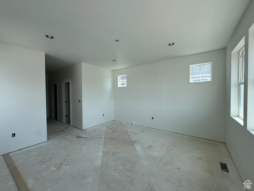 Empty room featuring a textured ceiling