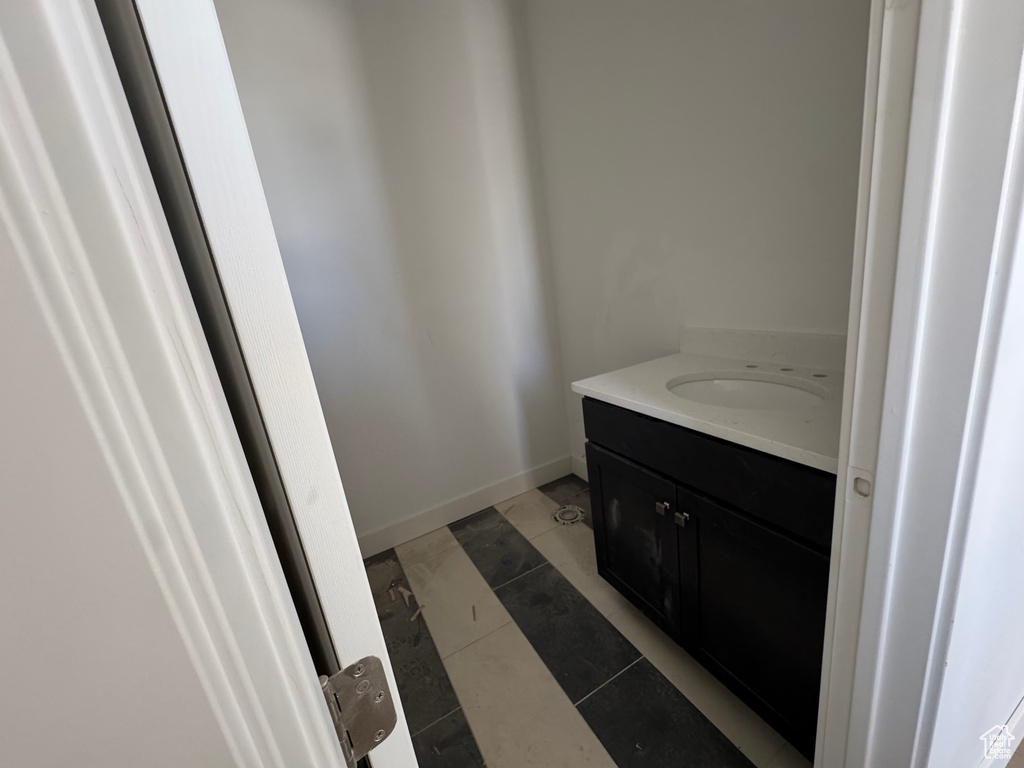 Bathroom with vanity and baseboards