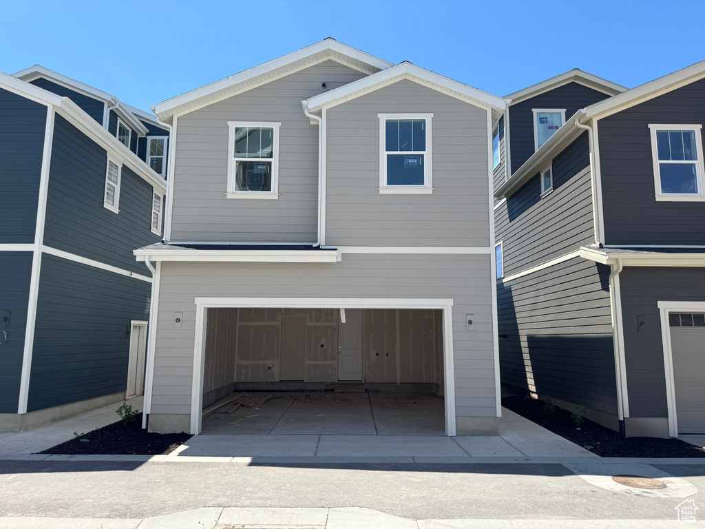 View of front of home featuring a garage