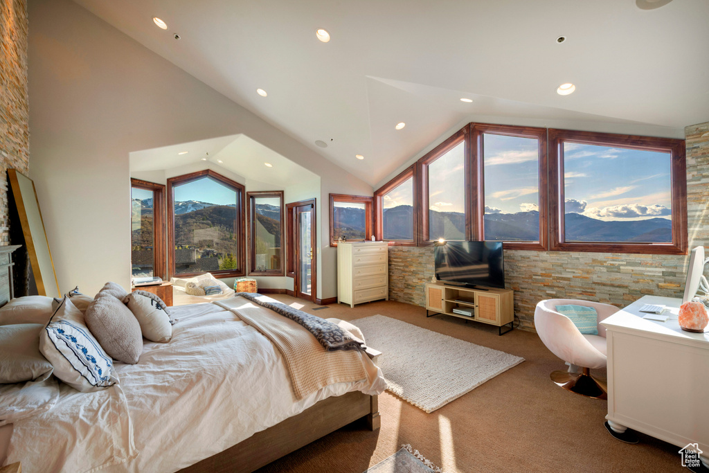 Bedroom with carpet floors, recessed lighting, and high vaulted ceiling