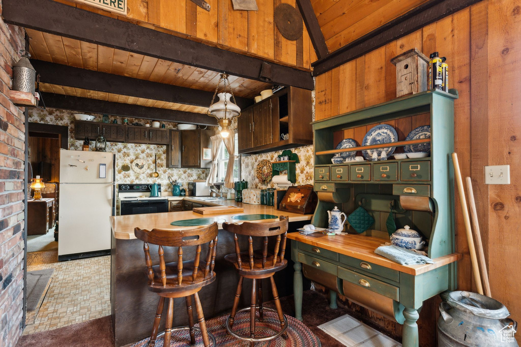 Kitchen with freestanding refrigerator, electric range, wooden ceiling, beamed ceiling, and open shelves