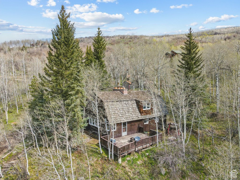 View from above of property featuring a forest