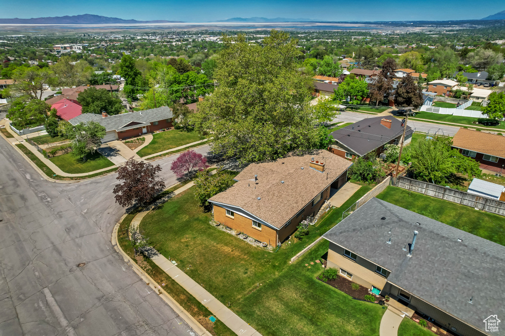 Aerial perspective of suburban area featuring a mountainous background