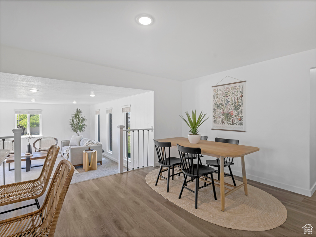 Dining area featuring wood finished floors, recessed lighting, and baseboards