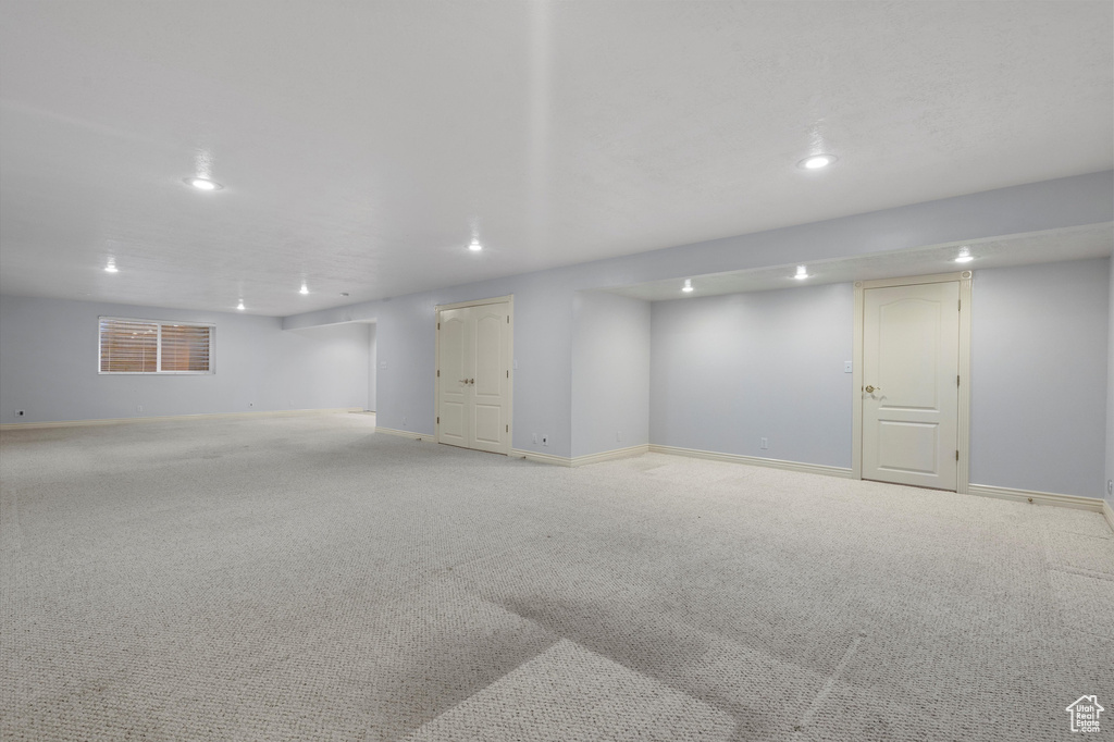 Finished basement with recessed lighting, baseboards, and carpet floors