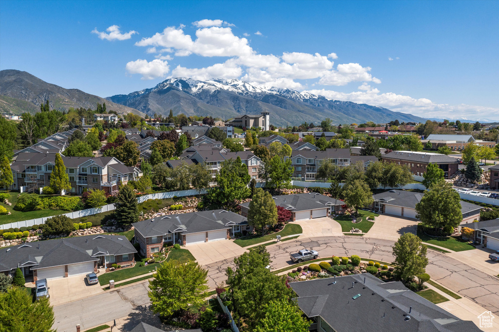 Aerial view of residential area with a mountainous background