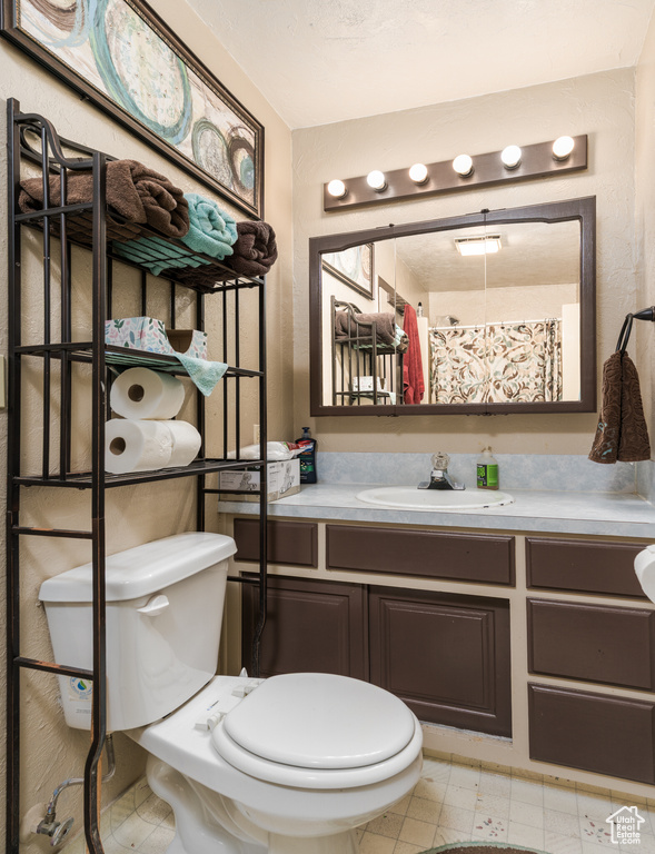 Bathroom with toilet and vanity