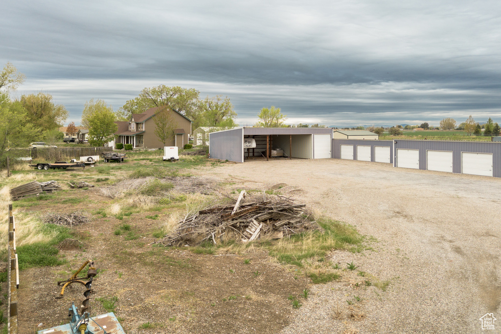 View of yard featuring an outbuilding and an outdoor structure