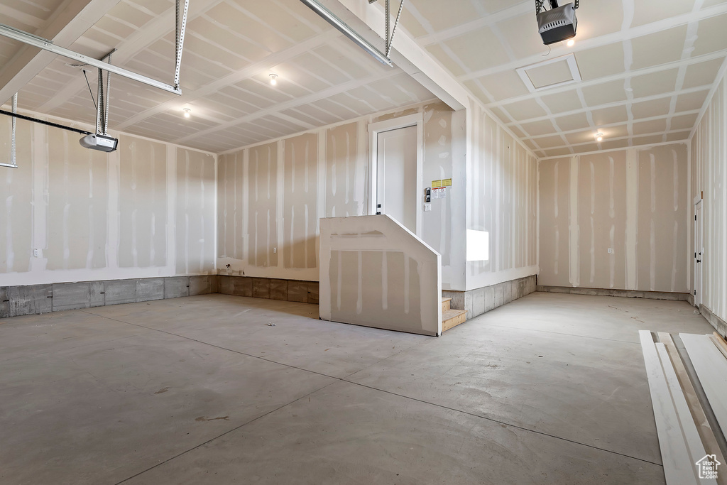 Garage featuring a garage door opener