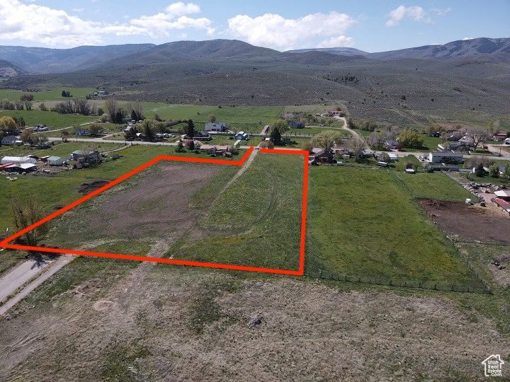 View of rural area with property parcel outlined and mountains