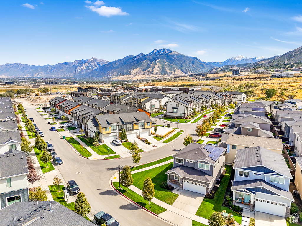 Aerial view of residential area featuring a mountain backdrop