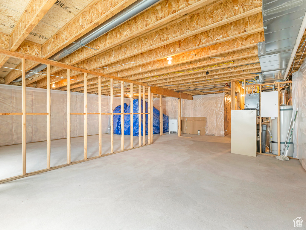 Unfinished below grade area featuring secured water heater