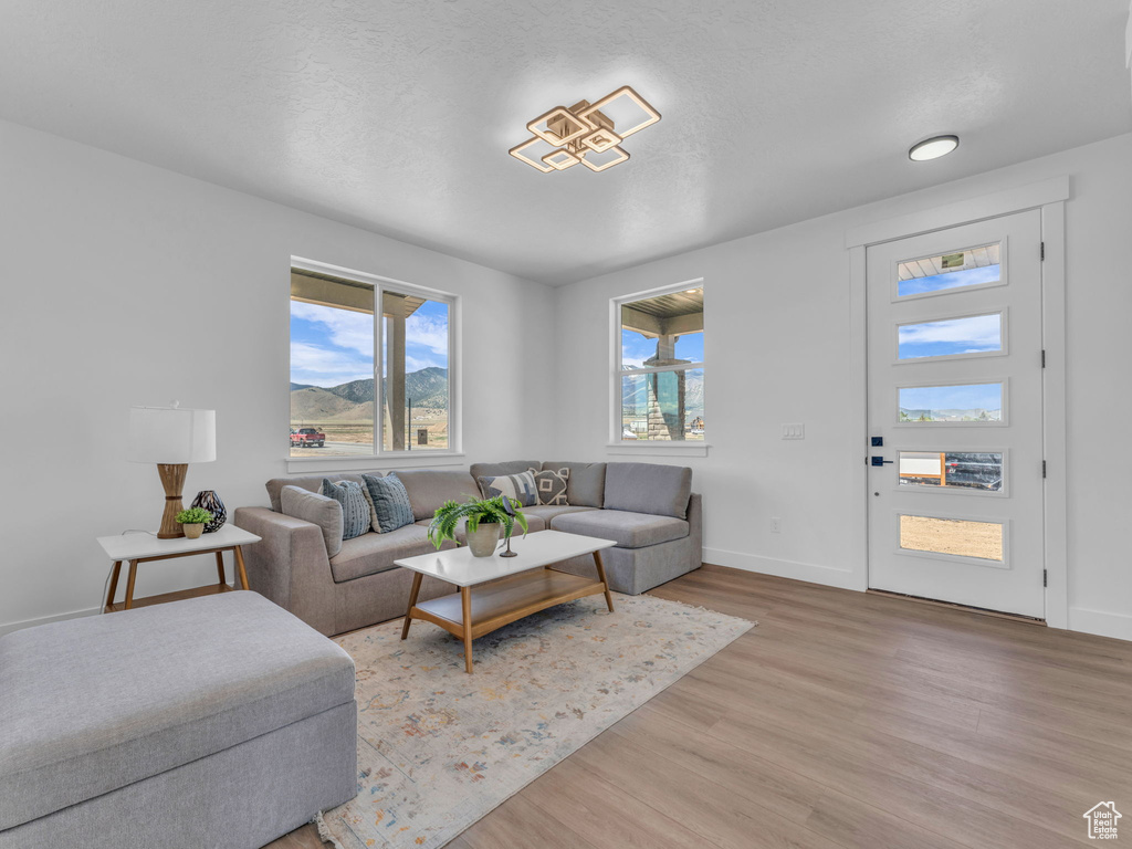 Living area featuring light wood finished floors and baseboards