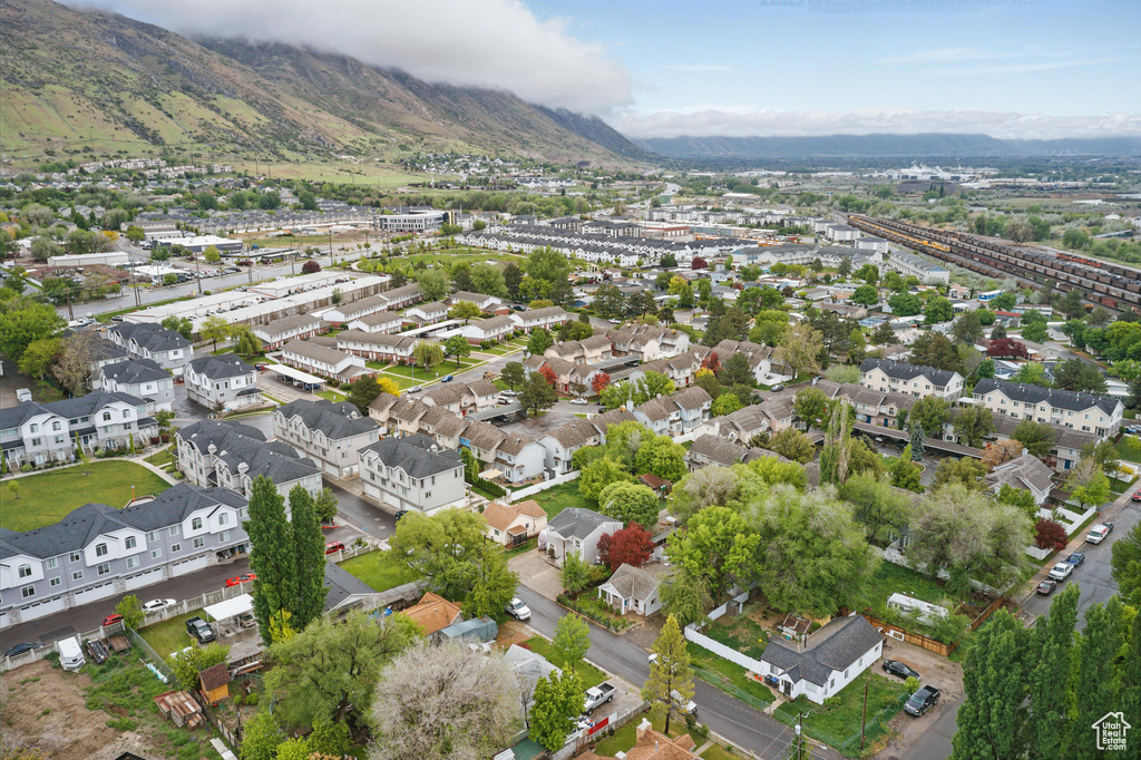 Aerial perspective of suburban area featuring a mountainous background