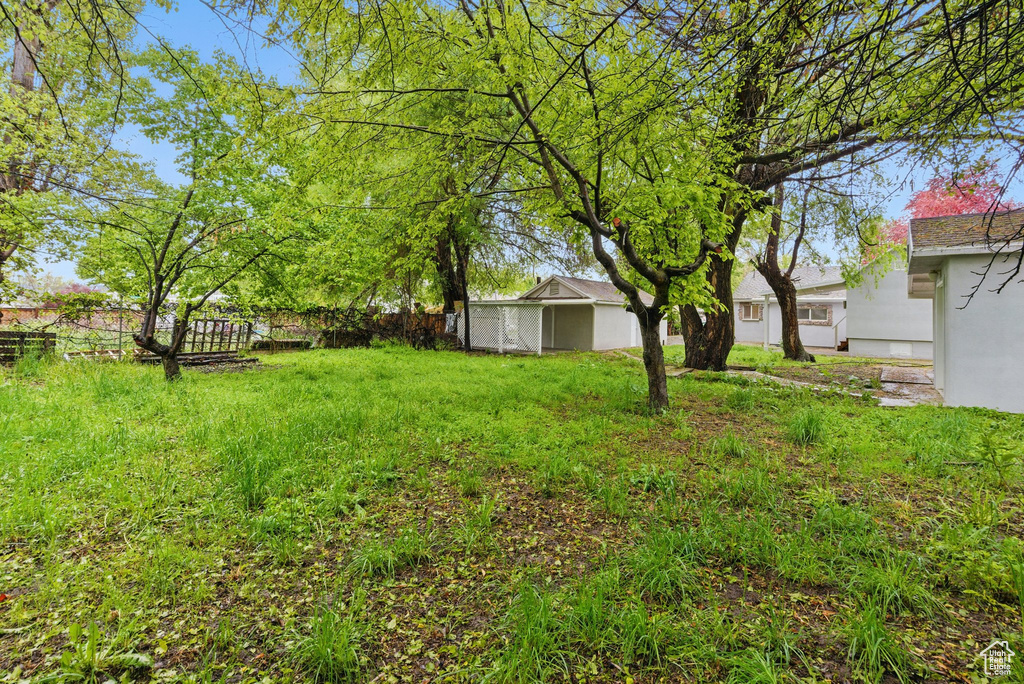 View of yard featuring fence