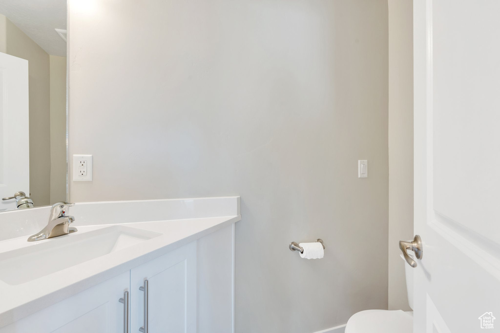 Bathroom with vanity and toilet