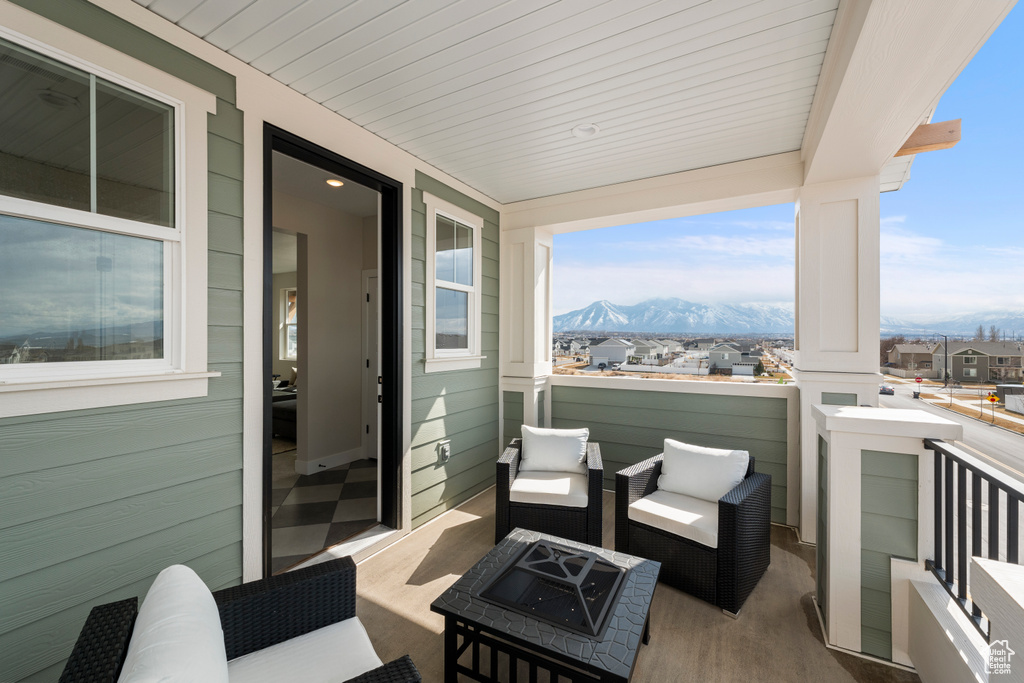 Balcony with an outdoor fire pit and a mountain view