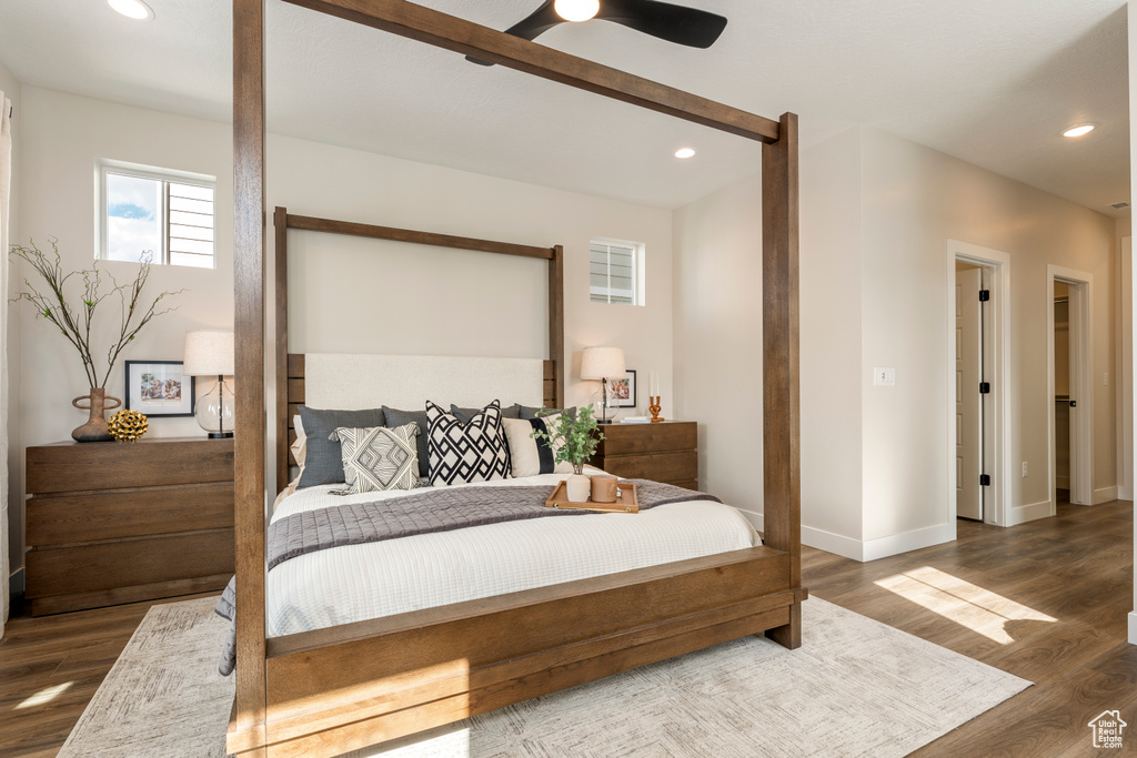 Bedroom featuring wood finished floors, recessed lighting, baseboards, and ceiling fan