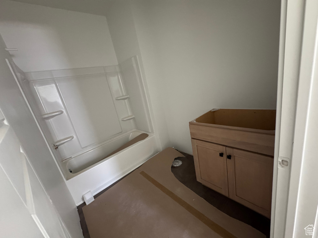 Bathroom featuring shower / bathtub combination and vanity