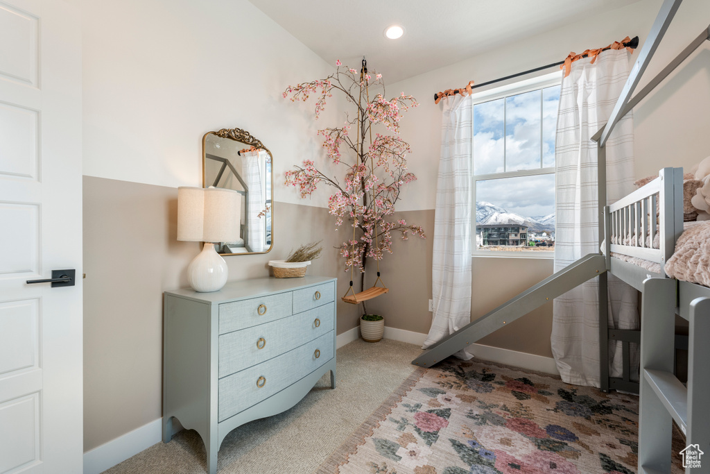 Bedroom with carpet floors and baseboards