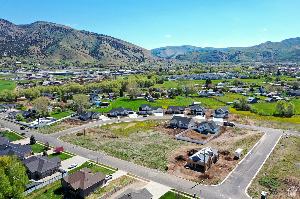 Aerial perspective of suburban area featuring a mountain backdrop