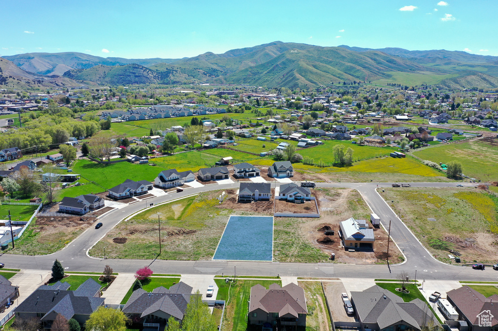 Aerial view of residential area featuring a mountainous background
