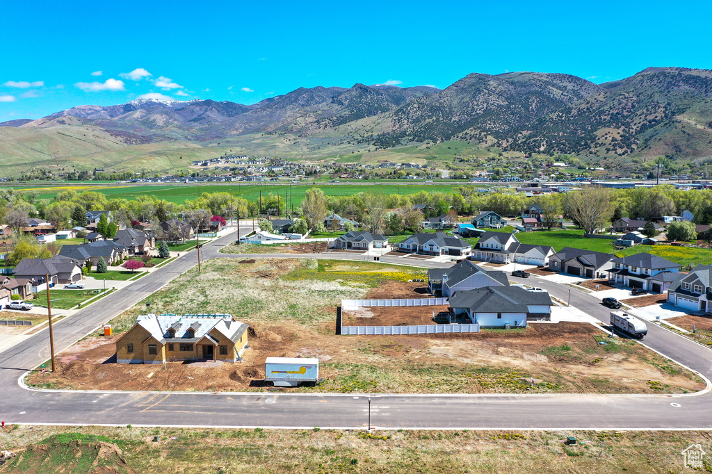 Aerial view of residential area featuring a mountainous background