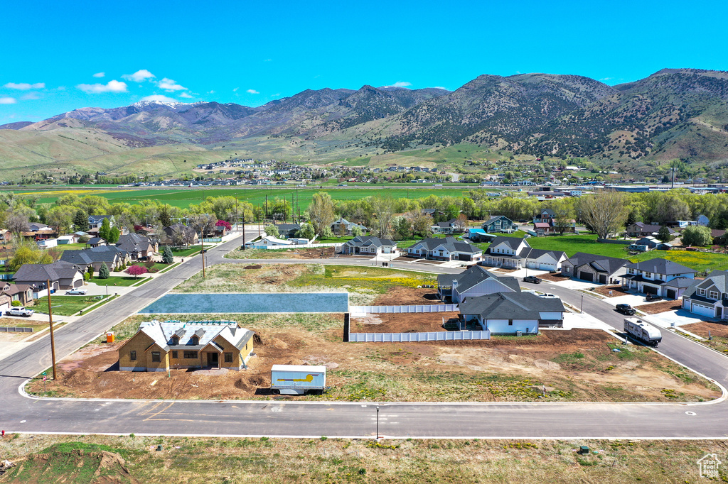 Aerial view of residential area featuring a mountain backdrop