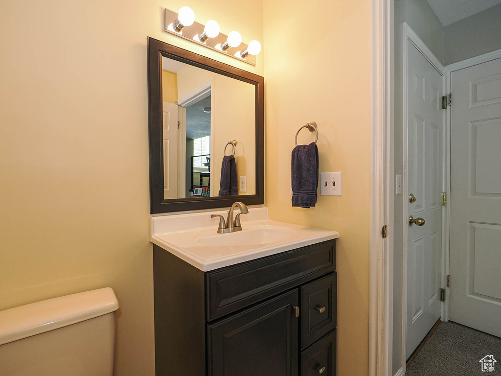 Bathroom with toilet and vanity