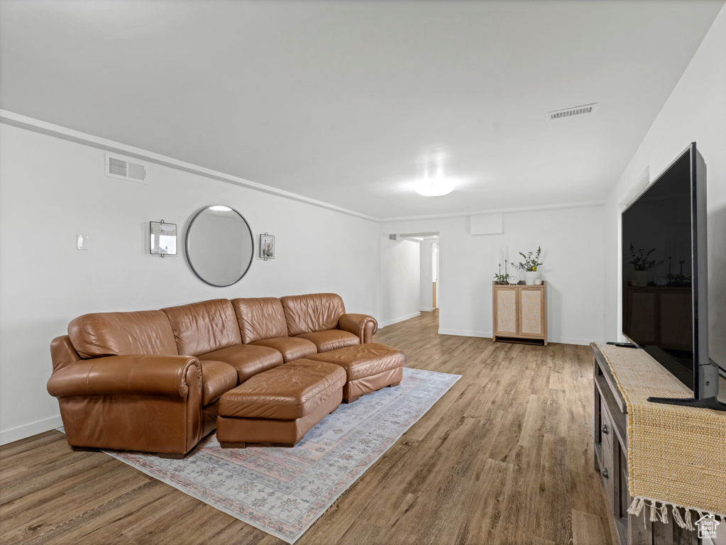 Living room featuring wood finished floors and baseboards