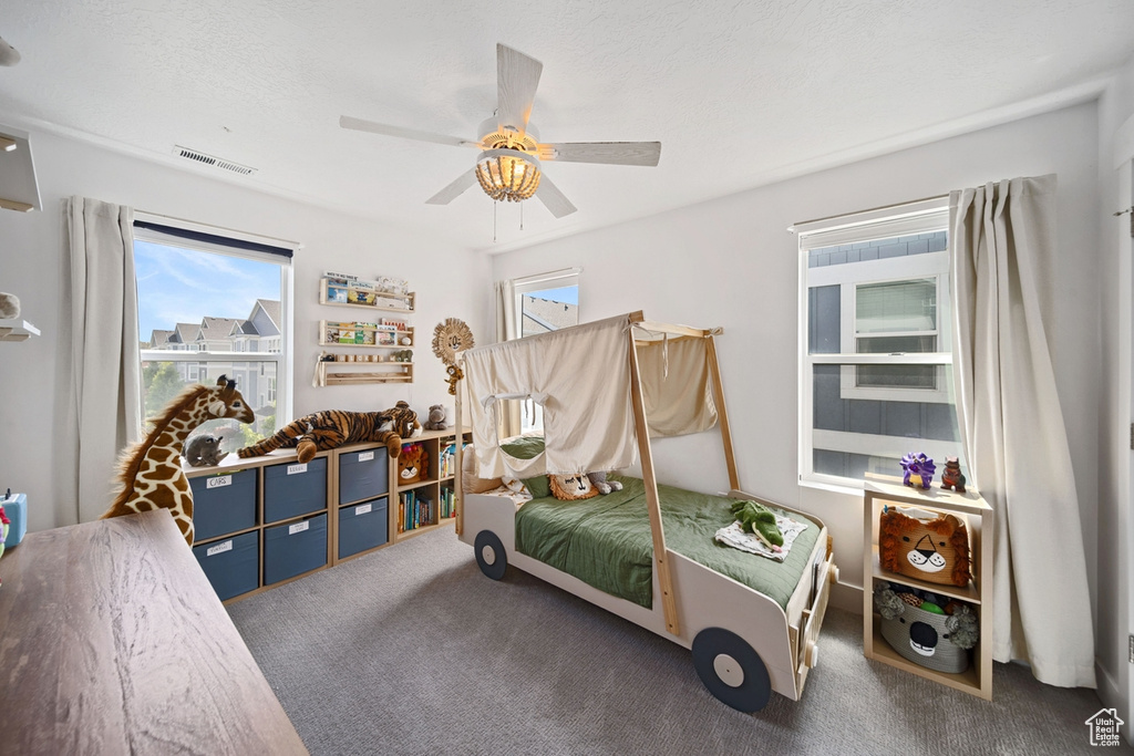 Bedroom with carpet and ceiling fan