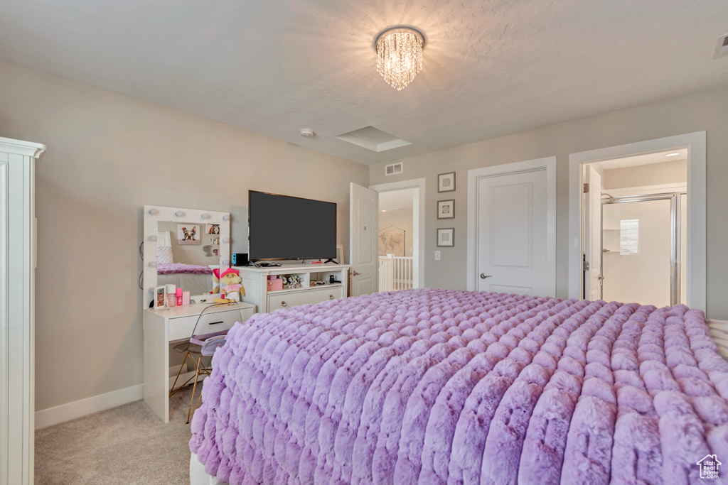 Bedroom featuring light carpet and baseboards