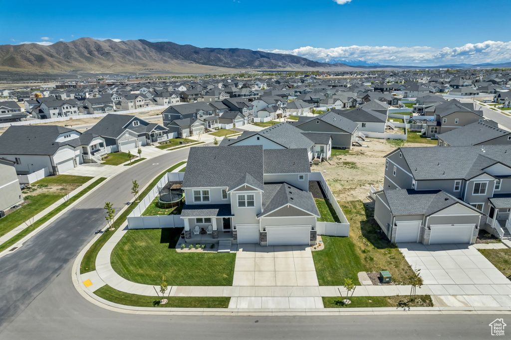 Aerial view of residential area with a mountain backdrop