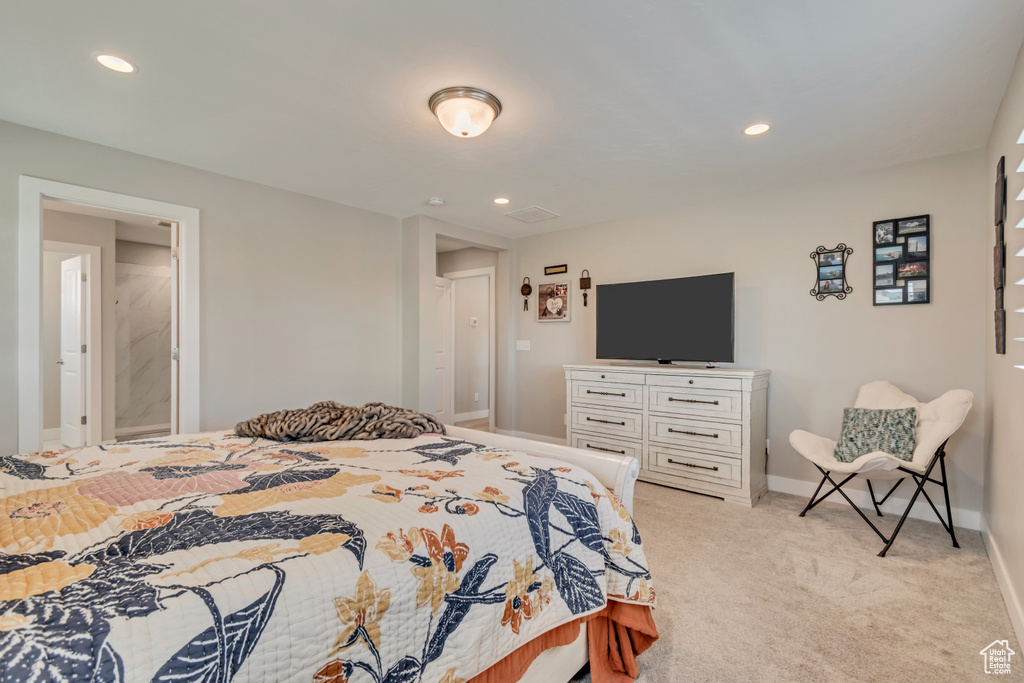 Bedroom featuring baseboards, light colored carpet, and recessed lighting