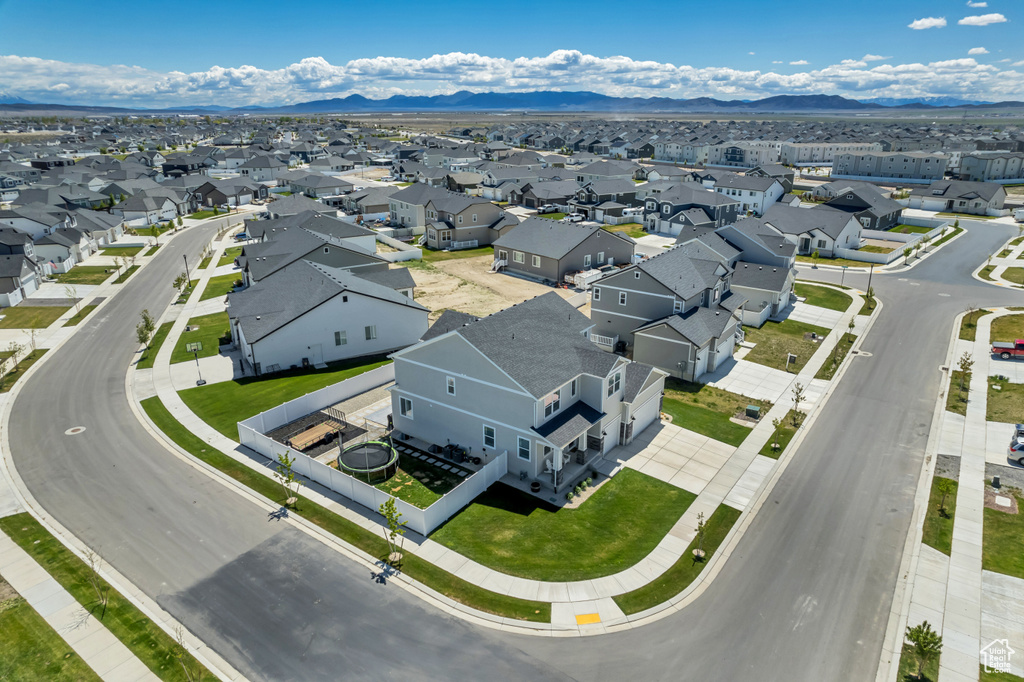 Aerial view of residential area featuring a mountain backdrop