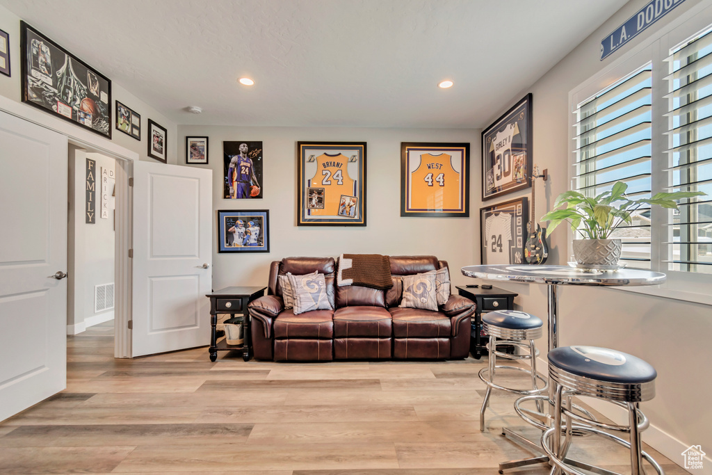 Living area featuring recessed lighting and light wood finished floors