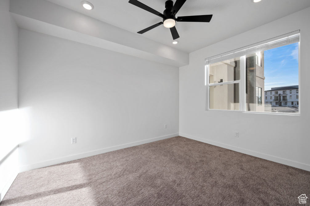 Empty room featuring baseboards, a ceiling fan, recessed lighting, and carpet floors