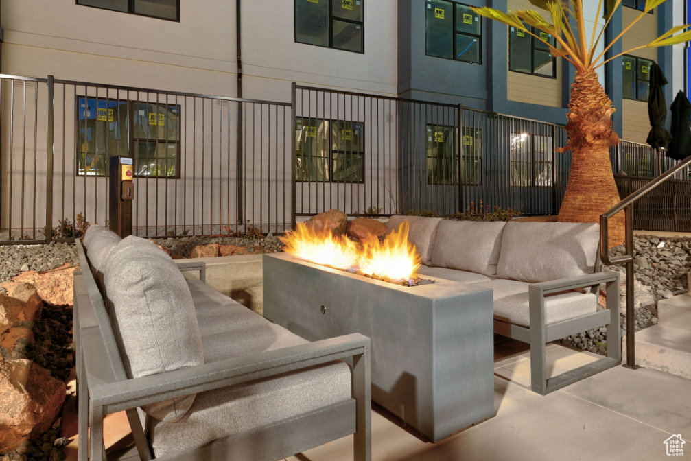 View of patio / terrace featuring an outdoor living space with a fire pit