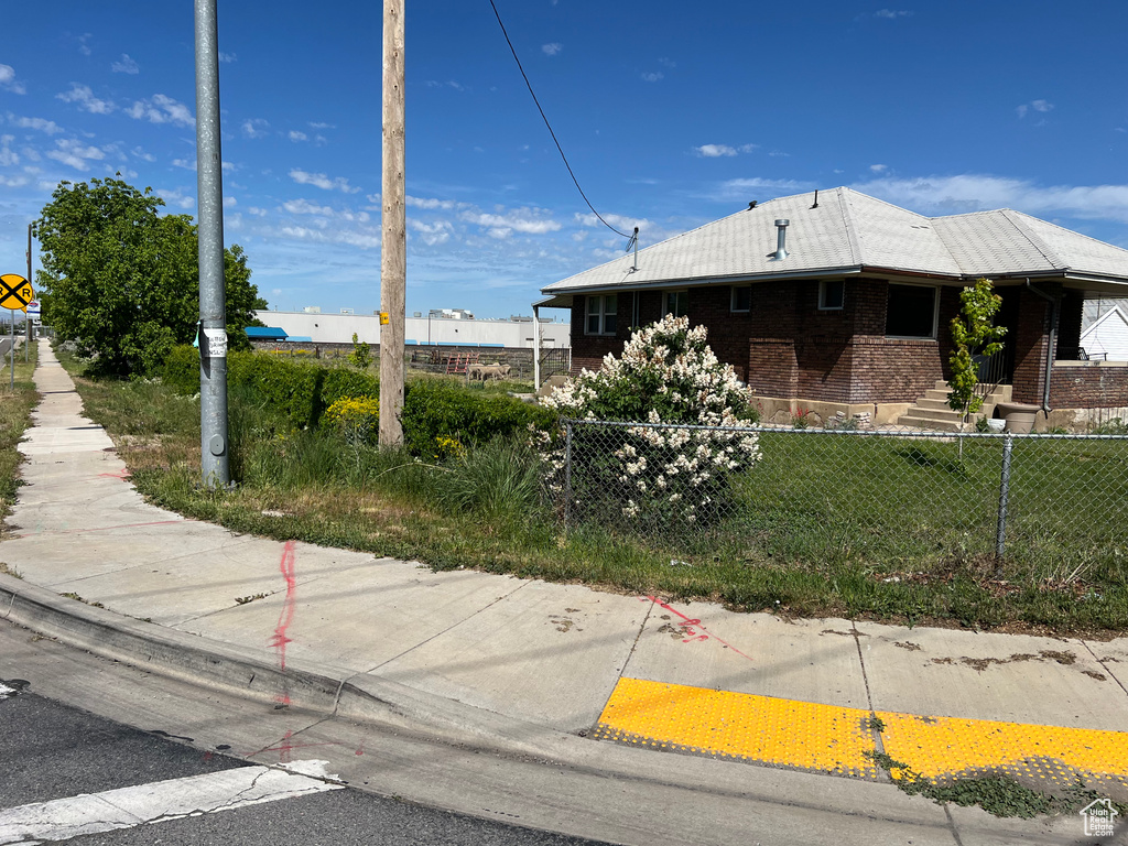 View of property exterior with brick siding