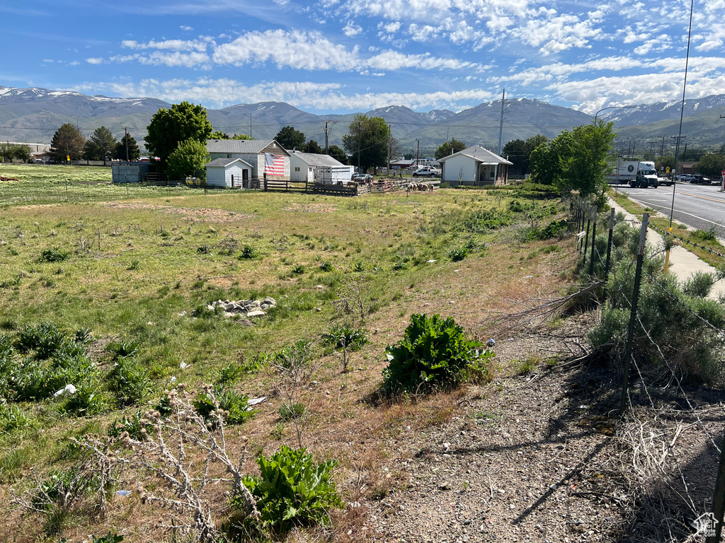View of mountain background featuring rural landscape