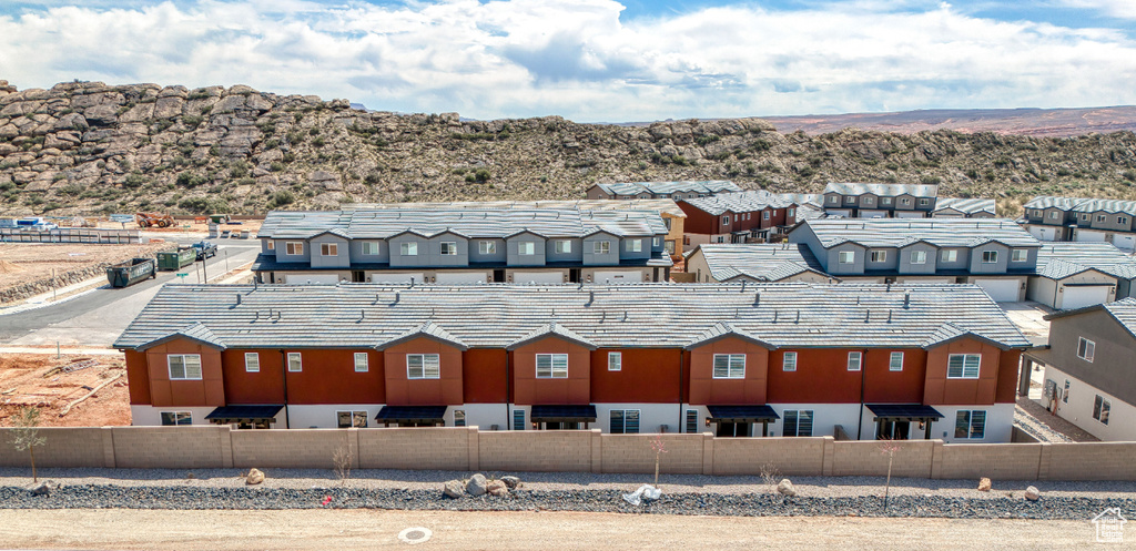 Aerial view of residential area featuring a mountain backdrop