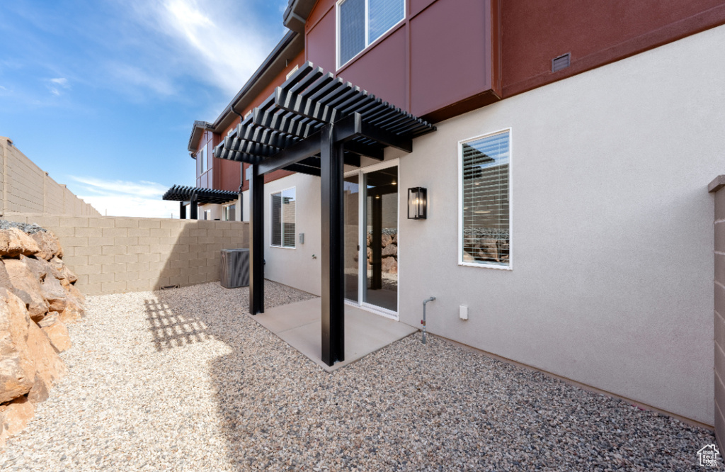 View of patio / terrace with fence and a pergola