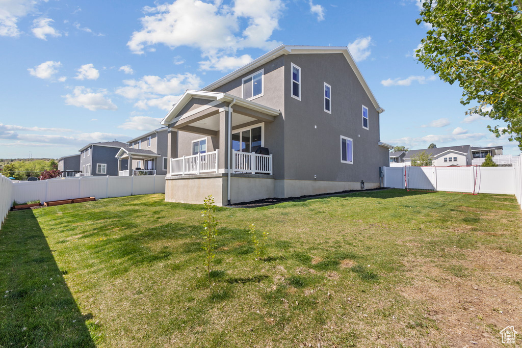 Back of property featuring stucco siding