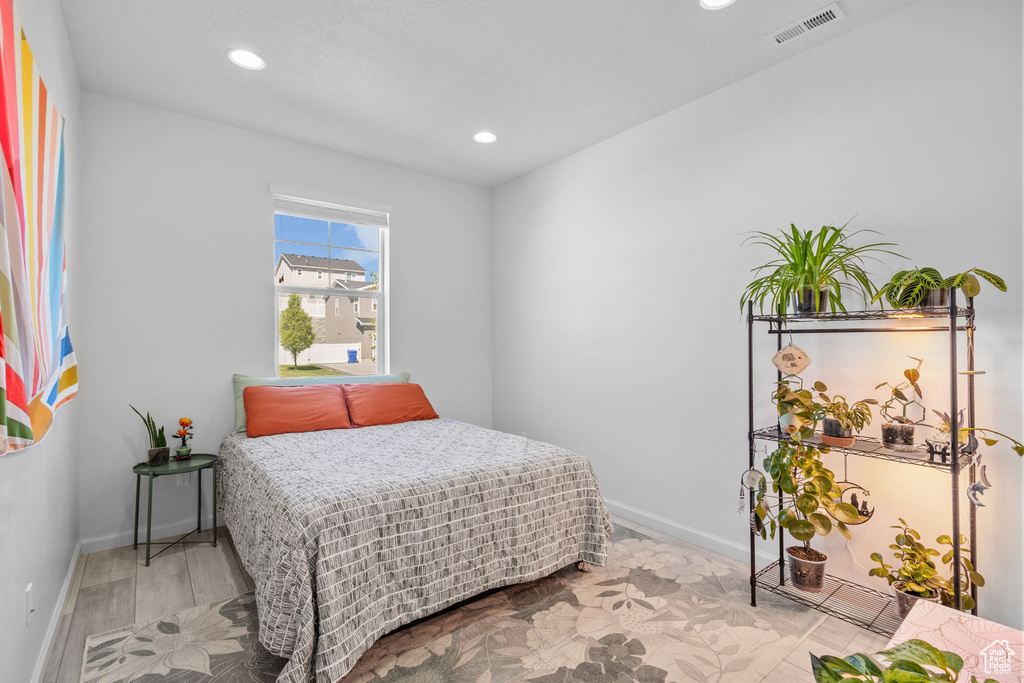 Bedroom featuring recessed lighting and baseboards