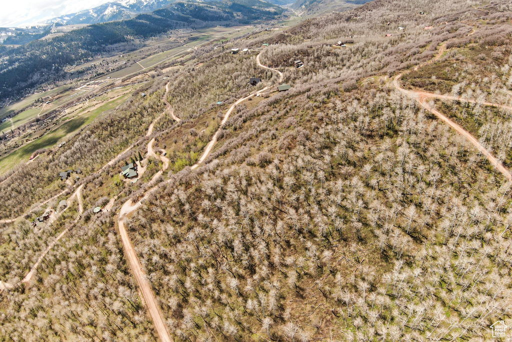 Aerial view of property\'s location featuring mountains