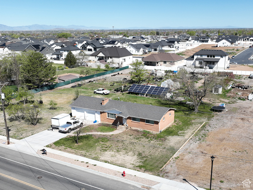 Aerial view of residential area featuring a mountain backdrop