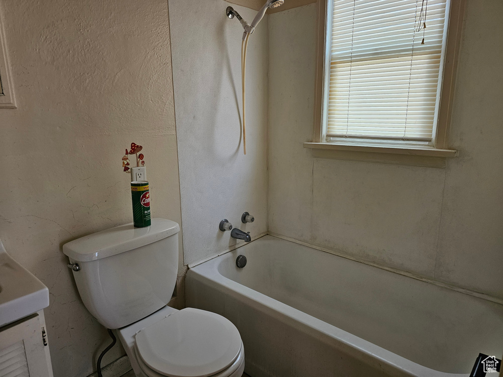 Full bath with toilet and bathtub / shower combination